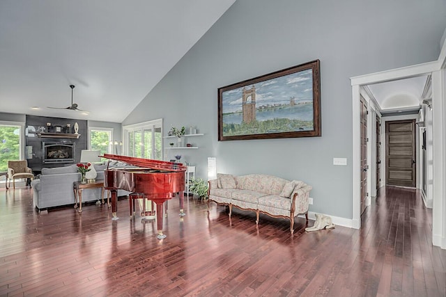 3270 Ballantree Way, Verona, KY 41092 - sitting room with wood finished floors, a fireplace, ceiling fan, baseboards, and high vaulted ceiling
