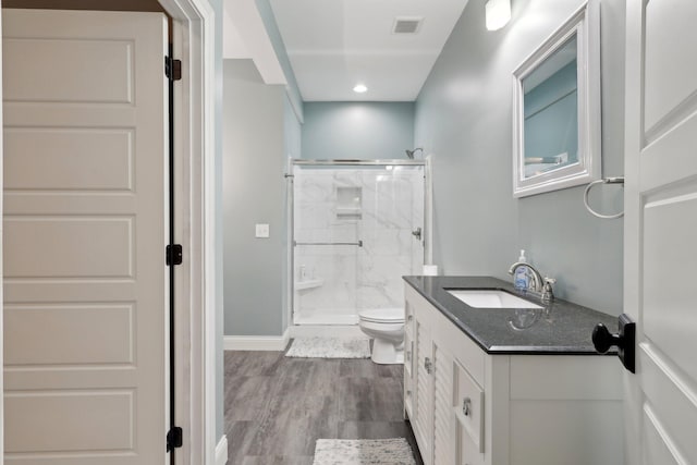 3270 Ballantree Way, Verona, KY 41092 - bathroom with a stall shower, toilet, vanity, wood finished floors, and baseboards