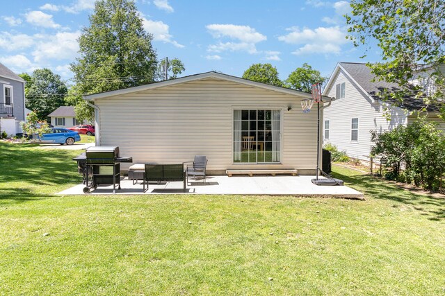 566 Sycamore St, Crescent Springs, KY 41017 - rear view of house featuring a patio and a lawn