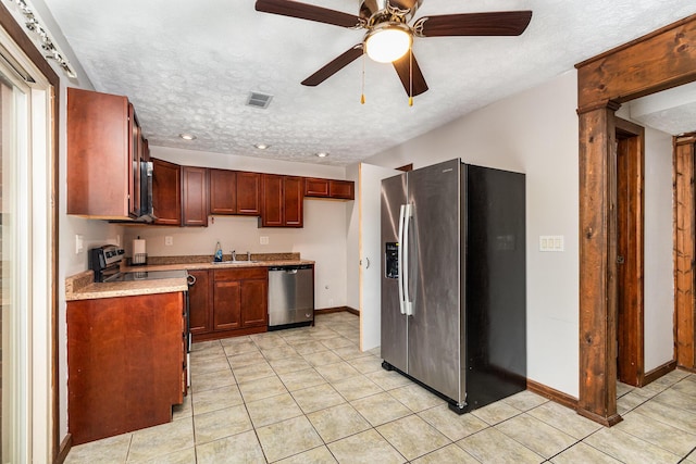6753 Curtis Way, Florence, KY 41042 - kitchen with stainless steel appliances, a textured ceiling, light tile patterned flooring, light countertops, and a ceiling fan