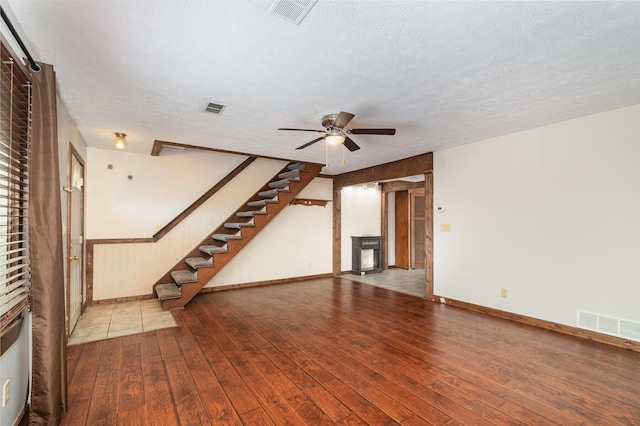 6753 Curtis Way, Florence, KY 41042 - unfurnished living room featuring a fireplace, hardwood / wood-style flooring, a ceiling fan, baseboards, and stairs