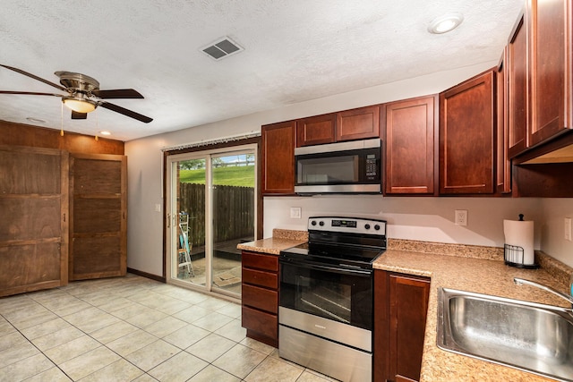 6753 Curtis Way, Florence, KY 41042 - kitchen featuring appliances with stainless steel finishes, a sink, a ceiling fan, light countertops, and light tile patterned floors