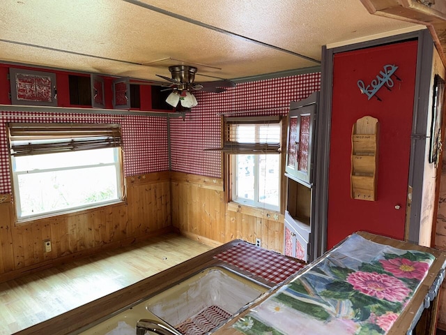 12544 Klein Rd, Morning View, KY 41063 - dining area with ceiling fan, wood finished floors, wooden walls, and a textured ceiling