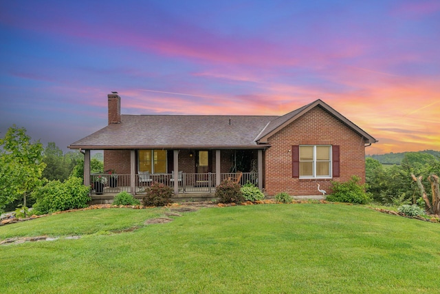 1019 Fisher Rd, Foster, KY 41043 - single story home with a chimney, brick siding, a lawn, a porch, and a shingled roof
