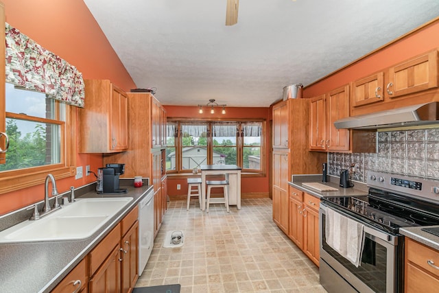 1019 Fisher Rd, Foster, KY 41043 - kitchen with stainless steel electric range oven, under cabinet range hood, a sink, dishwasher, and decorative backsplash