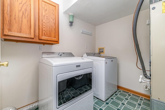 1019 Fisher Rd, Foster, KY 41043 - laundry room with cabinet space, independent washer and dryer, and baseboards