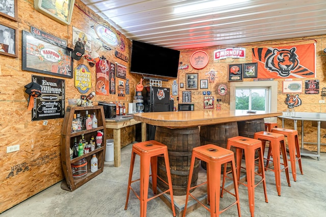 1019 Fisher Rd, Foster, KY 41043 - indoor bar featuring freestanding refrigerator and unfinished concrete floors
