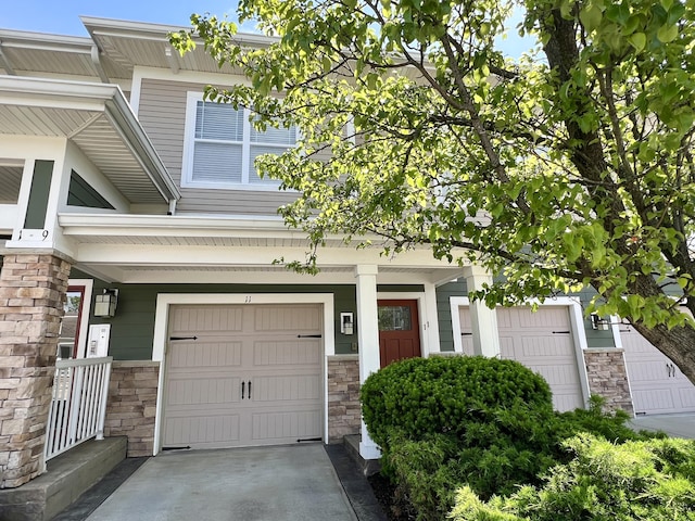 1859 Riverpointe Ct Unit 11, Dayton, KY 41074 - entrance to property featuring stone siding and a garage