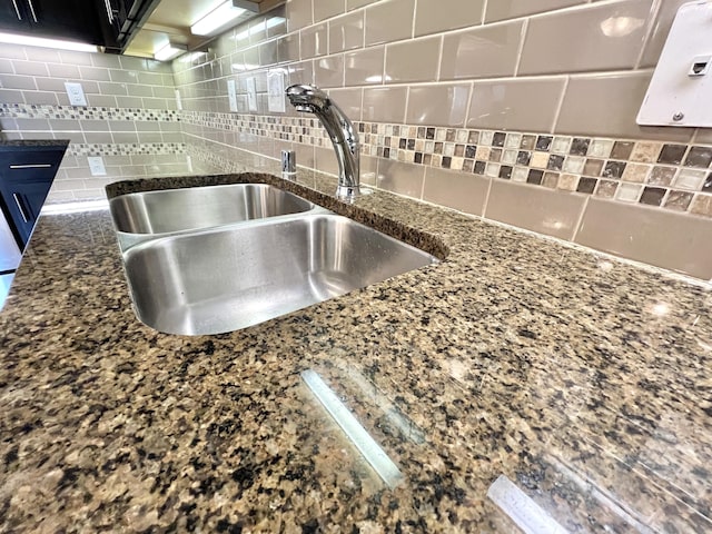 1859 Riverpointe Ct Unit 11, Dayton, KY 41074 - kitchen view of a sink, backsplash, and dark stone counters