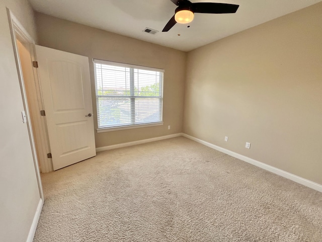 1859 Riverpointe Ct Unit 11, Dayton, KY 41074 - unfurnished room with baseboards, light colored carpet, and ceiling fan