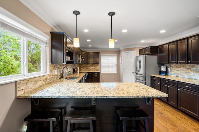 21 Laurel Ridge Dr, Alexandria, KY 41001 - kitchen with a sink, ornamental molding, dark brown cabinets, healthy amount of natural light, and recessed lighting