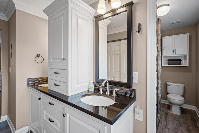 21 Laurel Ridge Dr, Alexandria, KY 41001 - bathroom featuring double vanity, wood finished floors, ornamental molding, baseboards, and toilet