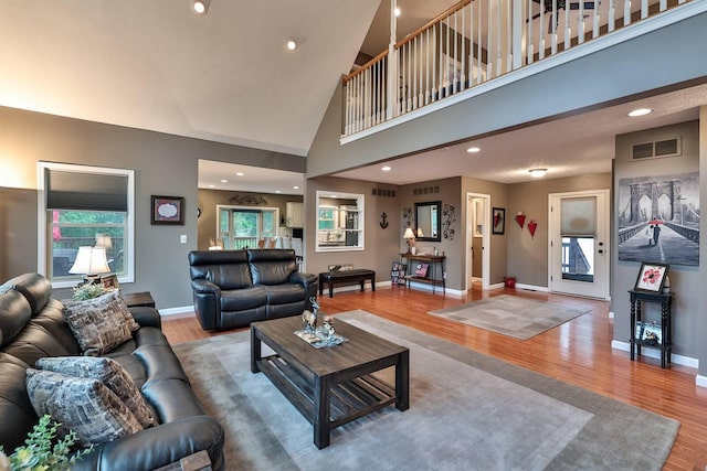 445 Elk Lake Resort Rd Unit 882, Owenton, KY 40359 - living room with wood finished floors, baseboards, healthy amount of natural light, high vaulted ceiling, and recessed lighting