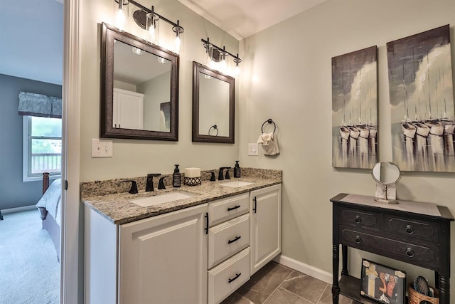 445 Elk Lake Resort Rd Unit 882, Owenton, KY 40359 - ensuite bathroom featuring double vanity, baseboards, and marble finish floors