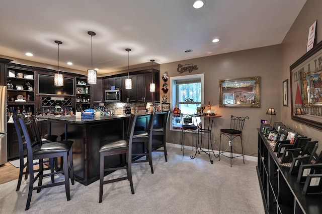 445 Elk Lake Resort Rd Unit 882, Owenton, KY 40359 - indoor bar featuring stainless steel appliances, recessed lighting, tasteful backsplash, hanging light fixtures, and light carpet