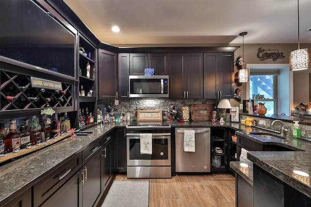 445 Elk Lake Resort Rd Unit 882, Owenton, KY 40359 - kitchen with stainless steel appliances, a sink, dark stone countertops, tasteful backsplash, and pendant lighting