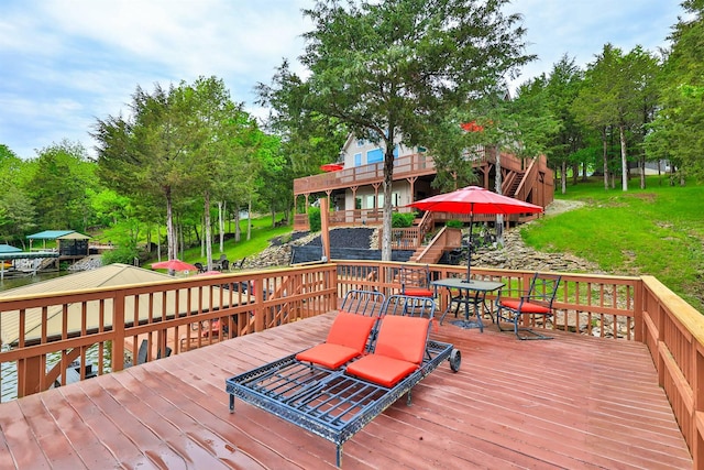 445 Elk Lake Resort Rd Unit 882, Owenton, KY 40359 - wooden deck with outdoor dining space and view of scattered trees