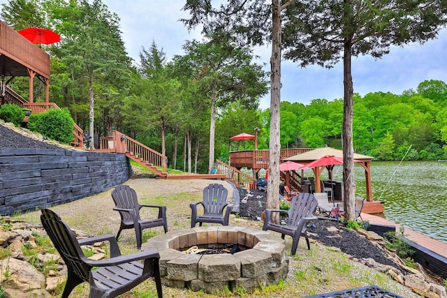 445 Elk Lake Resort Rd Unit 882, Owenton, KY 40359 - view of yard featuring stairs, a fire pit, a water view, a wooded view, and a boat dock