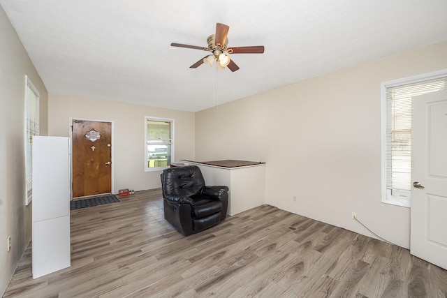 2418 Harris St, Crescent Springs, KY 41017 - unfurnished living room featuring light wood-style floors and ceiling fan