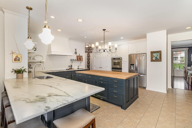 8394 Saint Louis Blvd, Union, KY 41091 - kitchen with appliances with stainless steel finishes, a sink, butcher block countertops, custom range hood, and white cabinets