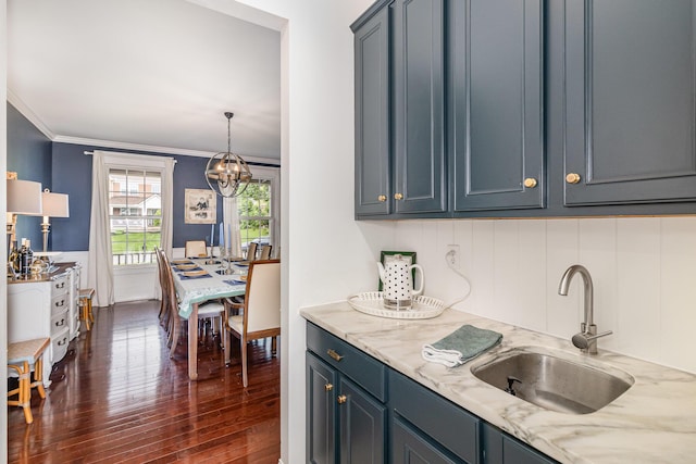 8394 Saint Louis Blvd, Union, KY 41091 - kitchen with a sink, dark wood-type flooring, a chandelier, light stone countertops, and ornamental molding