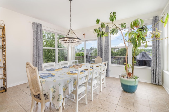 8394 Saint Louis Blvd, Union, KY 41091 - dining space featuring a chandelier, light tile patterned floors, and baseboards
