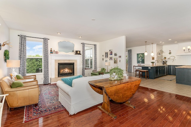 8394 Saint Louis Blvd, Union, KY 41091 - living area with wood-type flooring, a tiled fireplace, and recessed lighting