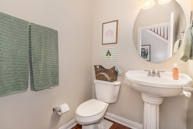 8394 Saint Louis Blvd, Union, KY 41091 - bathroom with baseboards, toilet, wood finished floors, and a sink