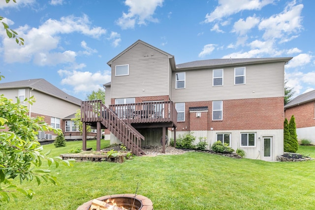 8394 Saint Louis Blvd, Union, KY 41091 - rear view of house with a fire pit, brick siding, a wooden deck, a lawn, and stairway