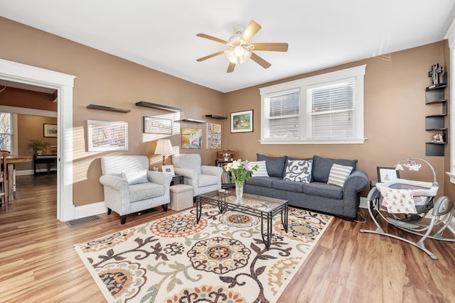 615 Highland Pike, Covington, KY 41014 - living room with a ceiling fan, wood finished floors, and baseboards