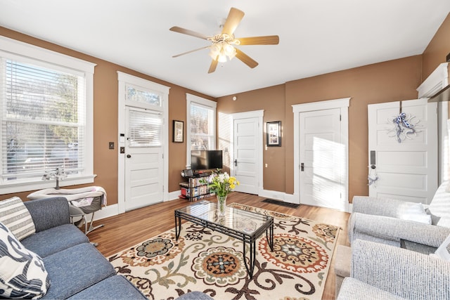 615 Highland Pike, Covington, KY 41014 - living room with ceiling fan, baseboards, and light wood-type flooring