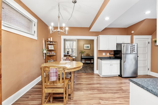 615 Highland Pike, Covington, KY 41014 - kitchen featuring freestanding refrigerator, light wood-type flooring, a chandelier, baseboards, and recessed lighting