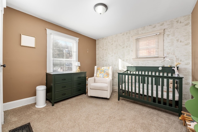615 Highland Pike, Covington, KY 41014 - bedroom with multiple windows, wallpapered walls, carpet floors, and baseboards