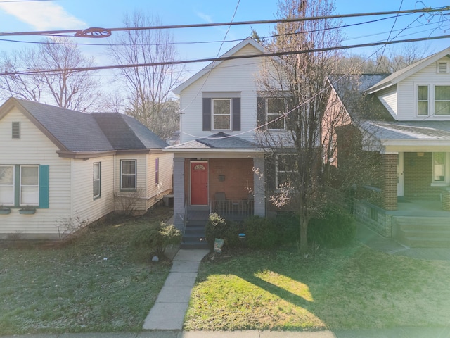615 Highland Pike, Covington, KY 41014 - view of front of property featuring covered porch, a front lawn, and roof with shingles