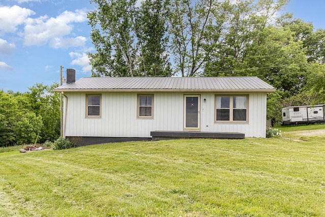 1750 Walnut Lick Rd, Verona, KY 41092 - view of front of house with a front lawn, a chimney, metal roof, and board and batten siding