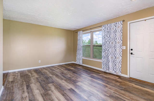 1750 Walnut Lick Rd, Verona, KY 41092 - foyer featuring dark wood-style flooring, a textured ceiling, and baseboards