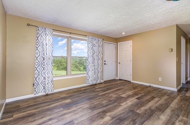 1750 Walnut Lick Rd, Verona, KY 41092 - unfurnished room with a textured ceiling, wood finished floors, baseboards, and recessed lighting