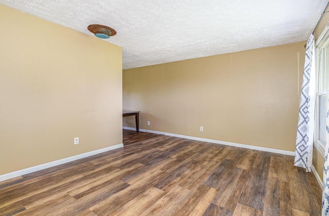 1750 Walnut Lick Rd, Verona, KY 41092 - empty room with a textured ceiling, dark wood-style floors, and baseboards