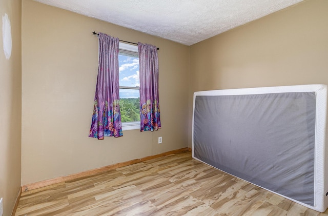 1750 Walnut Lick Rd, Verona, KY 41092 - empty room featuring wood finished floors, a textured ceiling, and baseboards