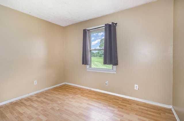 1750 Walnut Lick Rd, Verona, KY 41092 - empty room featuring light wood-style floors, baseboards, and a textured ceiling