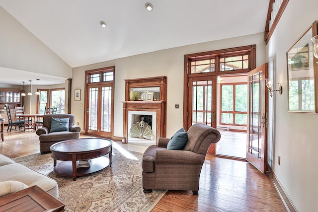 721 Dudley Rd, Edgewood, KY 41017 - living room with wood finished floors, high vaulted ceiling, a fireplace, baseboards, and recessed lighting