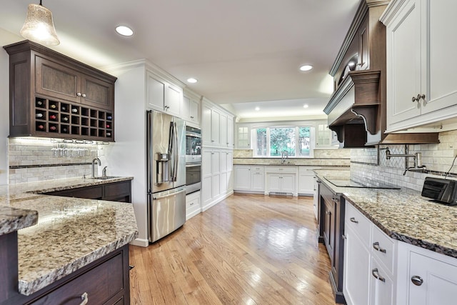 721 Dudley Rd, Edgewood, KY 41017 - kitchen featuring appliances with stainless steel finishes, a sink, backsplash, light stone counters, and recessed lighting