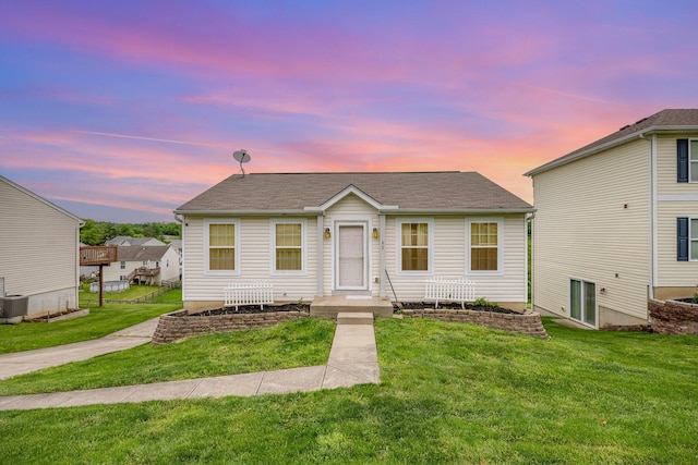 92 High St, Walton, KY 41094 - view of front of property featuring a front lawn, roof with shingles, and central AC unit