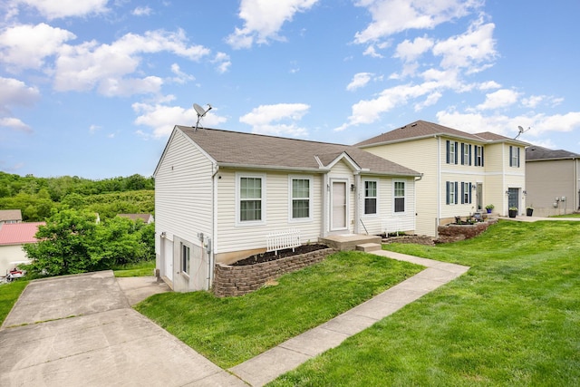 92 High St, Walton, KY 41094 - view of front of property featuring a front yard, a garage, and concrete driveway