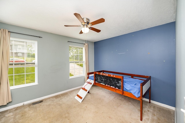 92 High St, Walton, KY 41094 - unfurnished bedroom featuring baseboards, carpet floors, and ceiling fan