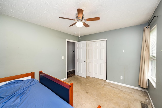 92 High St, Walton, KY 41094 - bedroom with baseboards, carpet floors, a closet, and a ceiling fan