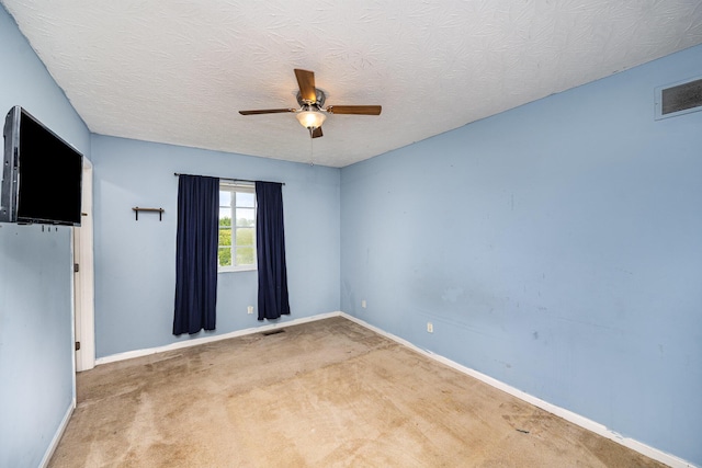 92 High St, Walton, KY 41094 - carpeted spare room featuring ceiling fan, baseboards, and a textured ceiling