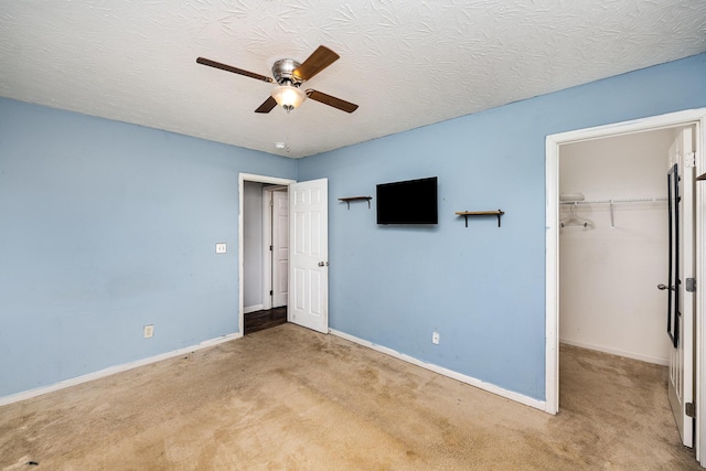 92 High St, Walton, KY 41094 - unfurnished bedroom with carpet floors, a spacious closet, a closet, and baseboards