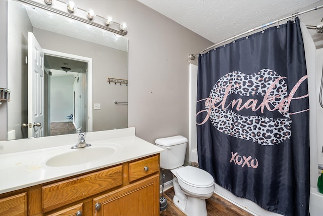 92 High St, Walton, KY 41094 - full bathroom featuring vanity, shower / tub combo, toilet, wood finished floors, and a textured ceiling