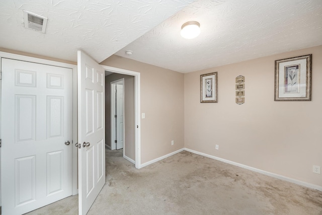 92 High St, Walton, KY 41094 - unfurnished bedroom with light colored carpet, baseboards, and a textured ceiling